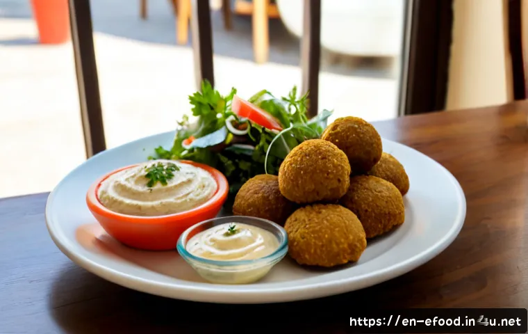 팔라펠 맛집 추천 - Photorealistic cozy Middle Eastern restaurant table, a generous plate of golden crispy falafel with ...